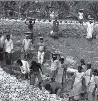 The file captures a manual labor site with workers engaged in construction or earth-moving activities outdoors.